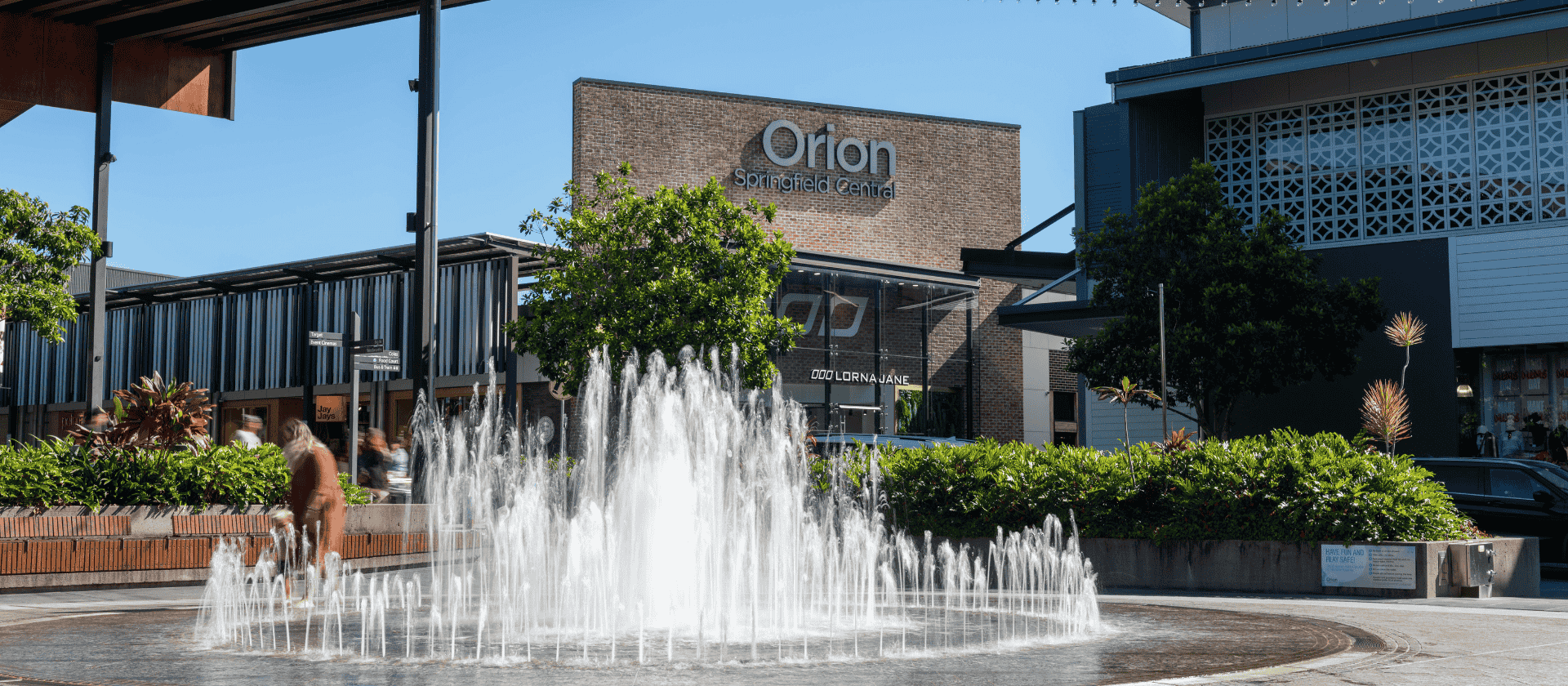 Orion Springfield Central shopping center exterior fountain and storefronts in Springfield Queensland