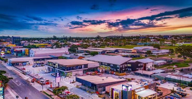 Aerial view of Logan QLD commercial business precinct and shopping center at sunset